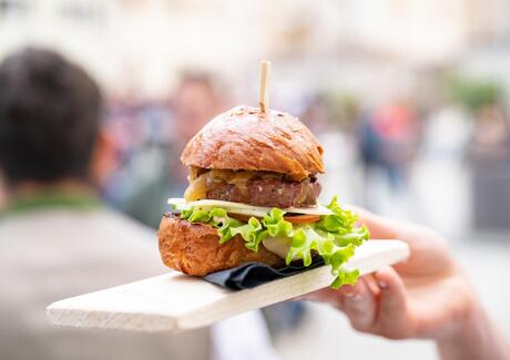 Hamburger served on a wooden board